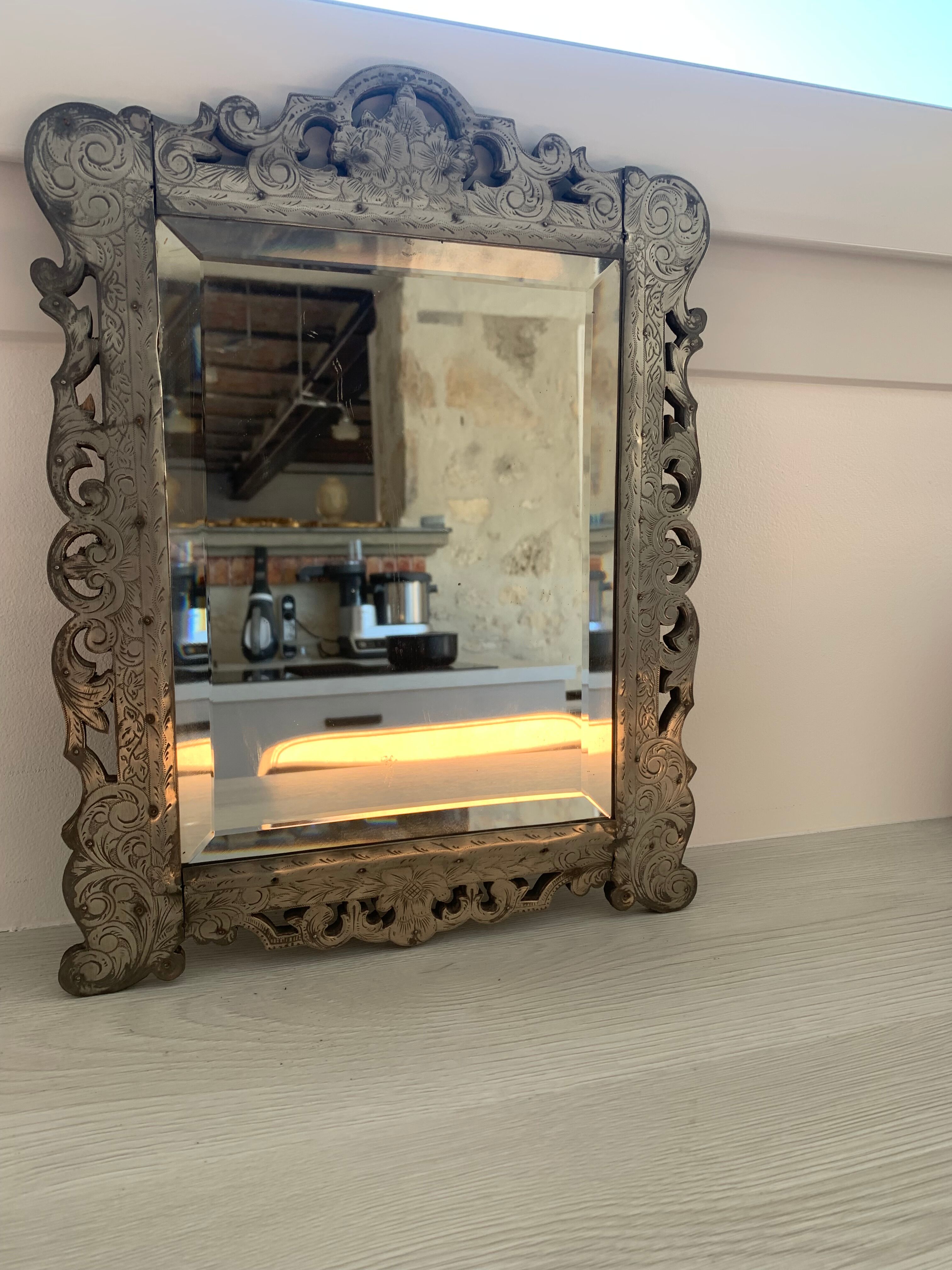 Eventful beveled mirror and openwork period 1900 repelled tin decoration