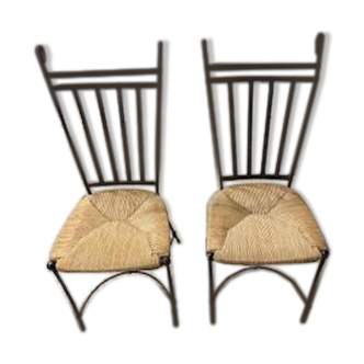 2 iron and straw chairs