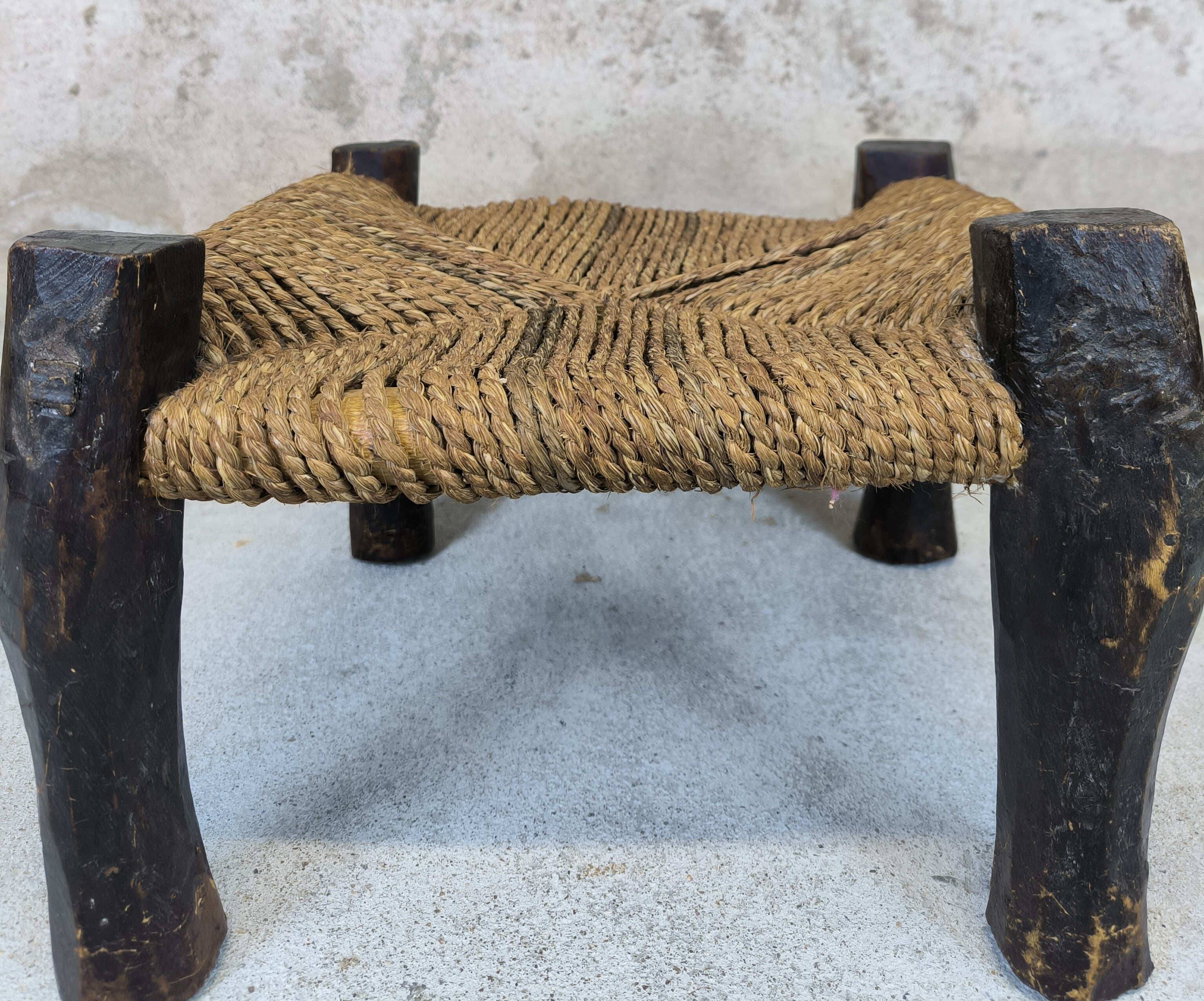 Vintage low stool in wood and straw.