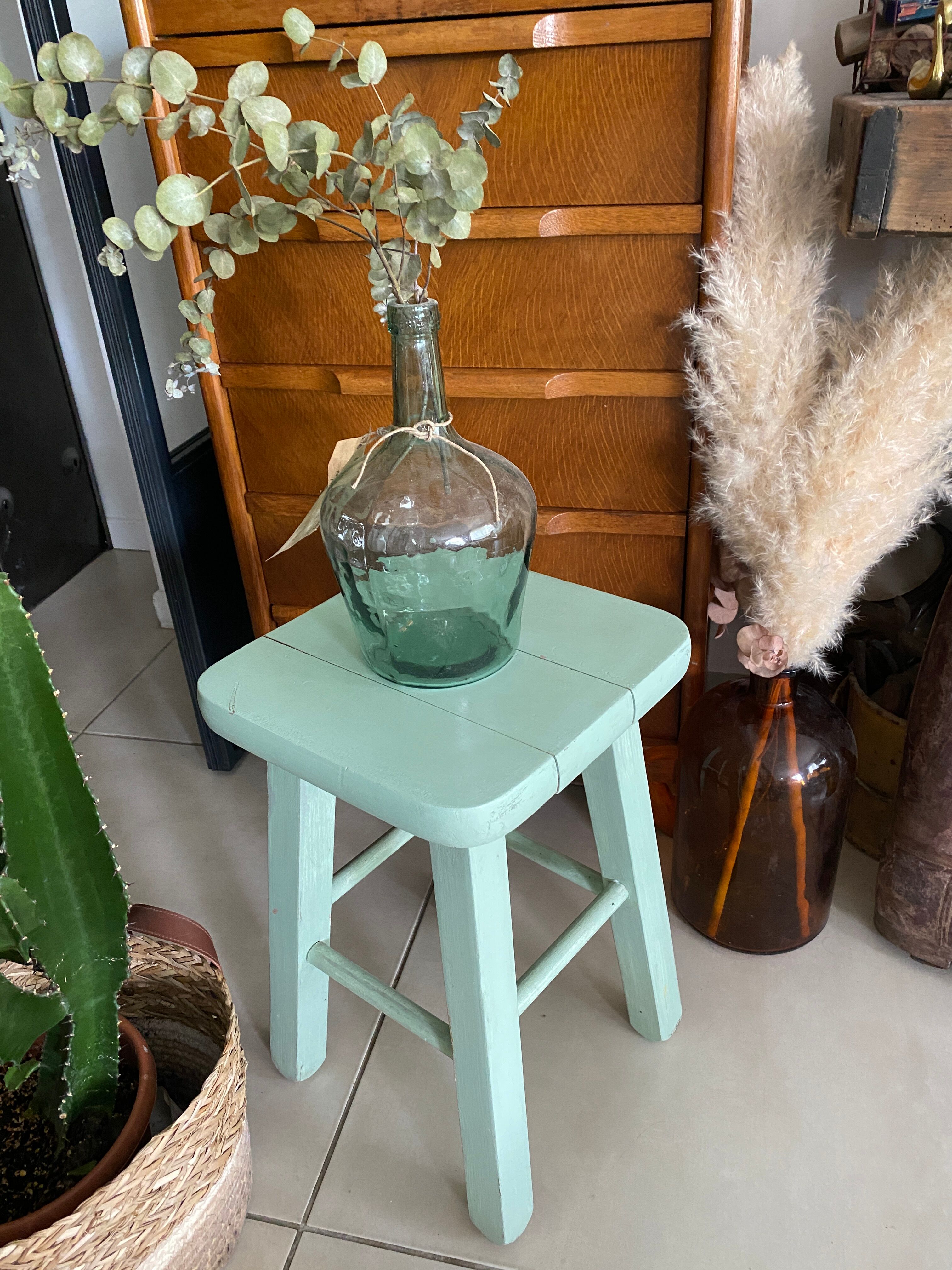 Old almond green wooden stool