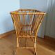Rattan wicker cradle on wooden wheels