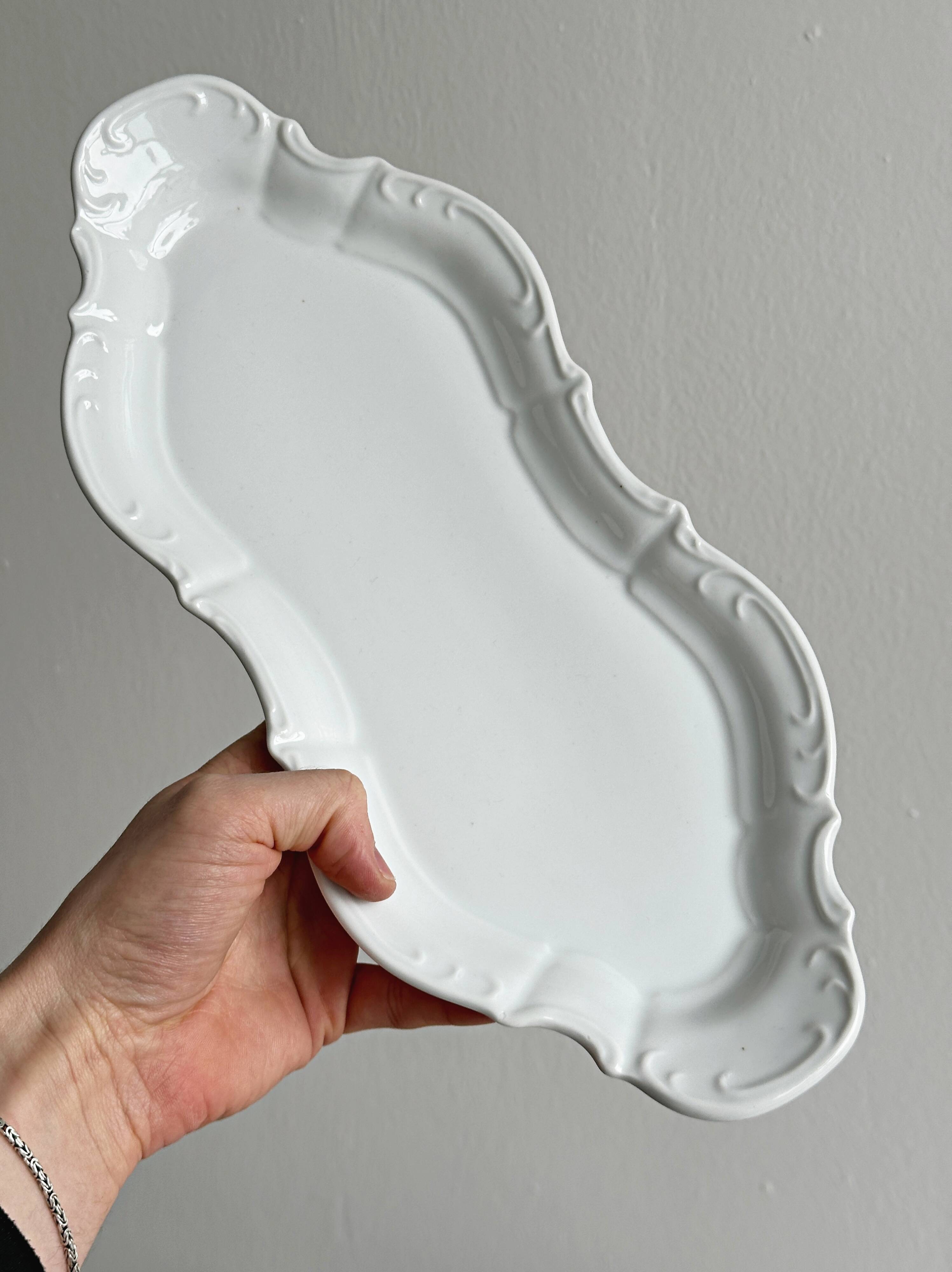 white porcelain plate in an unusual shape