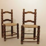 Pair of rustic chairs in turned wood with straw seats