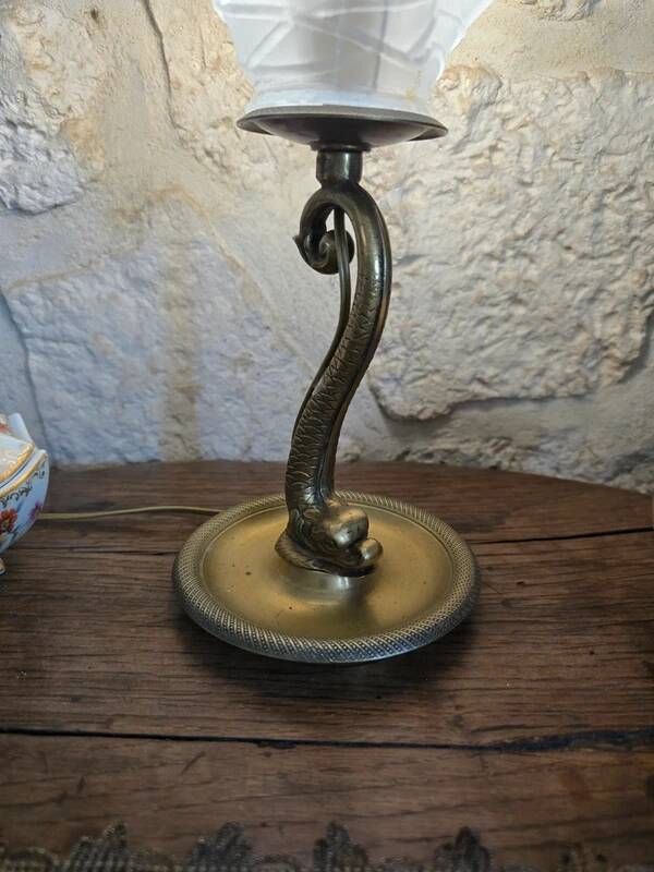 Table lamp with brass fish and draped glass tulip.