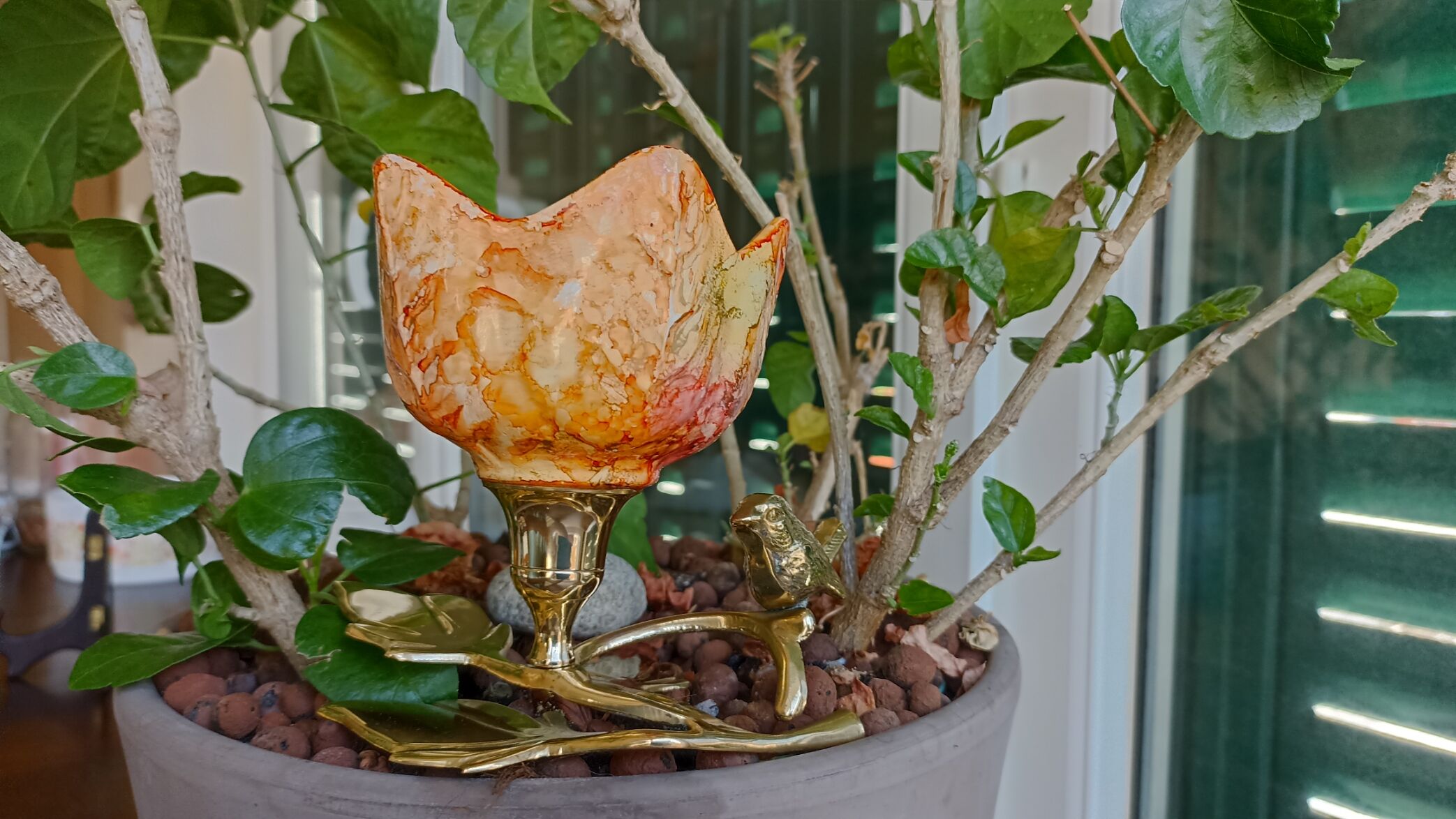 Brass cup in the shape of a bird and flowers