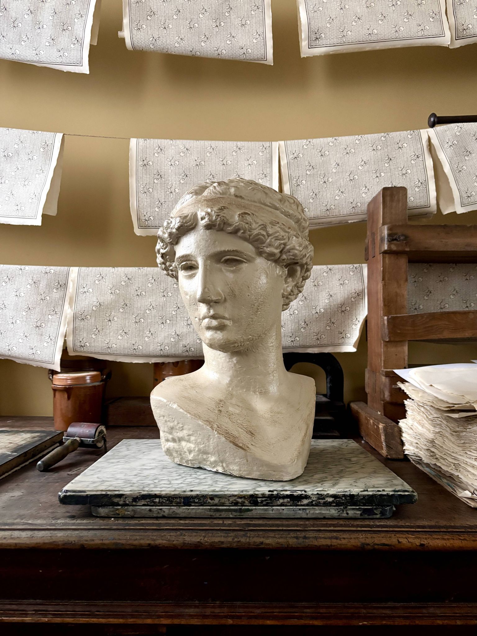 Concrete bust painted in beige - reproduction, detail of "The Dying Slave"