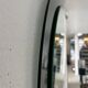 Decorative round wall mirror in smoked glass, Space Age Italian collectible
