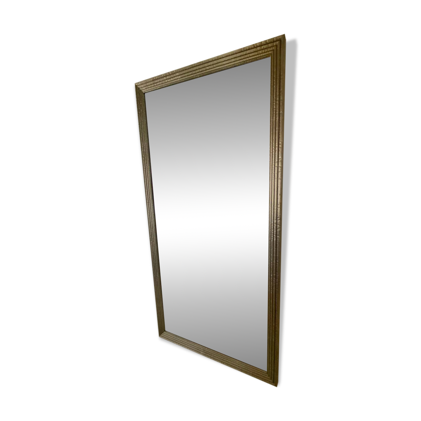 Textured embossed metal wall mirror with bevelled mirror.
