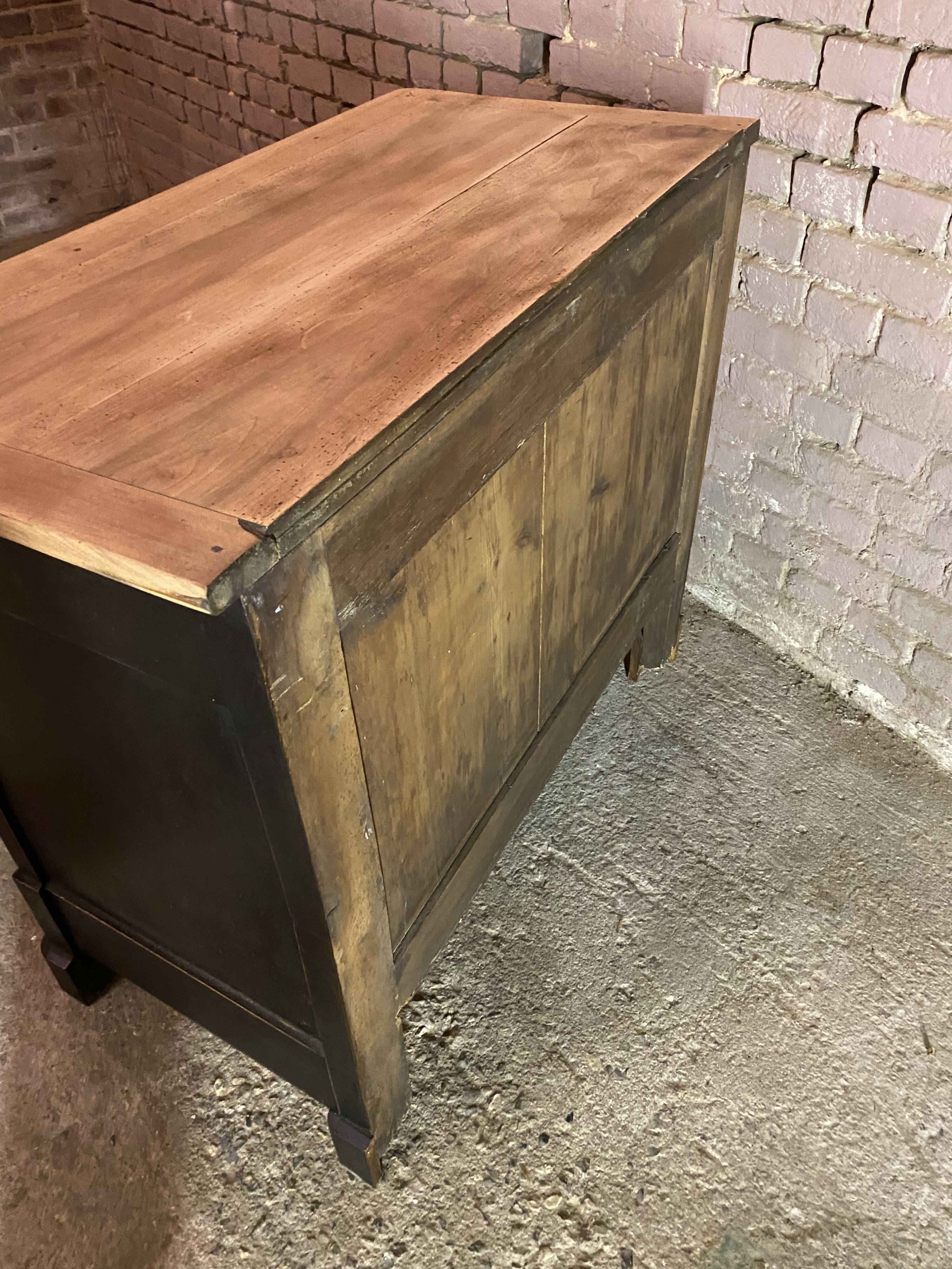 Old black patinated chest of drawers