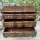 Carved and moulded solid wood commode in the Louis XV style.