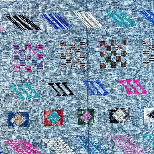 Faded blue Berber ethnic carpet