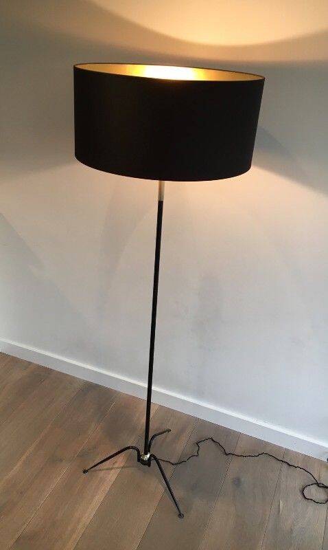 Floor lamp in black lacquered metal and brass