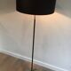 Floor lamp in black lacquered metal and brass