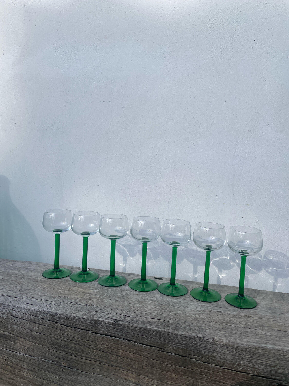 7 green glass stemmed glasses