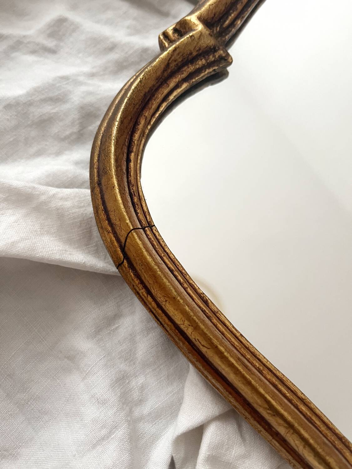 Antique Louis XV gilded mirror with vintage rocaille shell