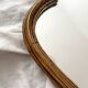 Antique Louis XV gilded mirror with vintage rocaille shell