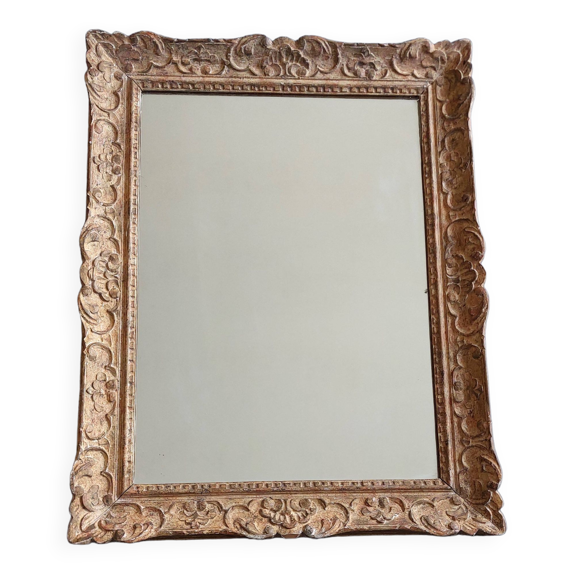 Large Montparnasse rocaille style frame in carved wood mounted in mirror.
