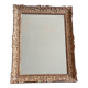 Large Montparnasse rocaille style frame in carved wood mounted in mirror.