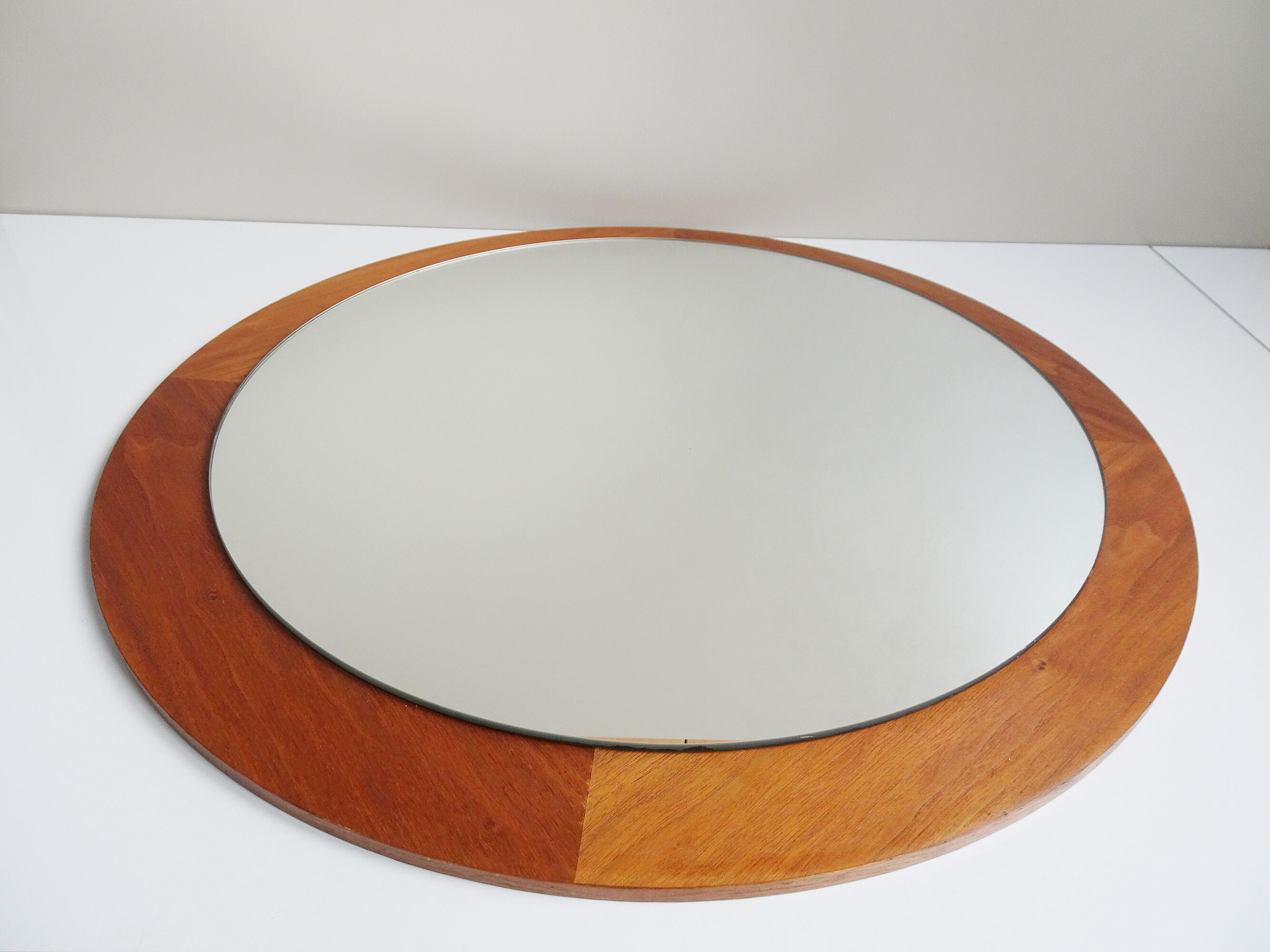 round teak mirror