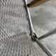 Set of two vintage folding chairs with an aluminium wire frame.