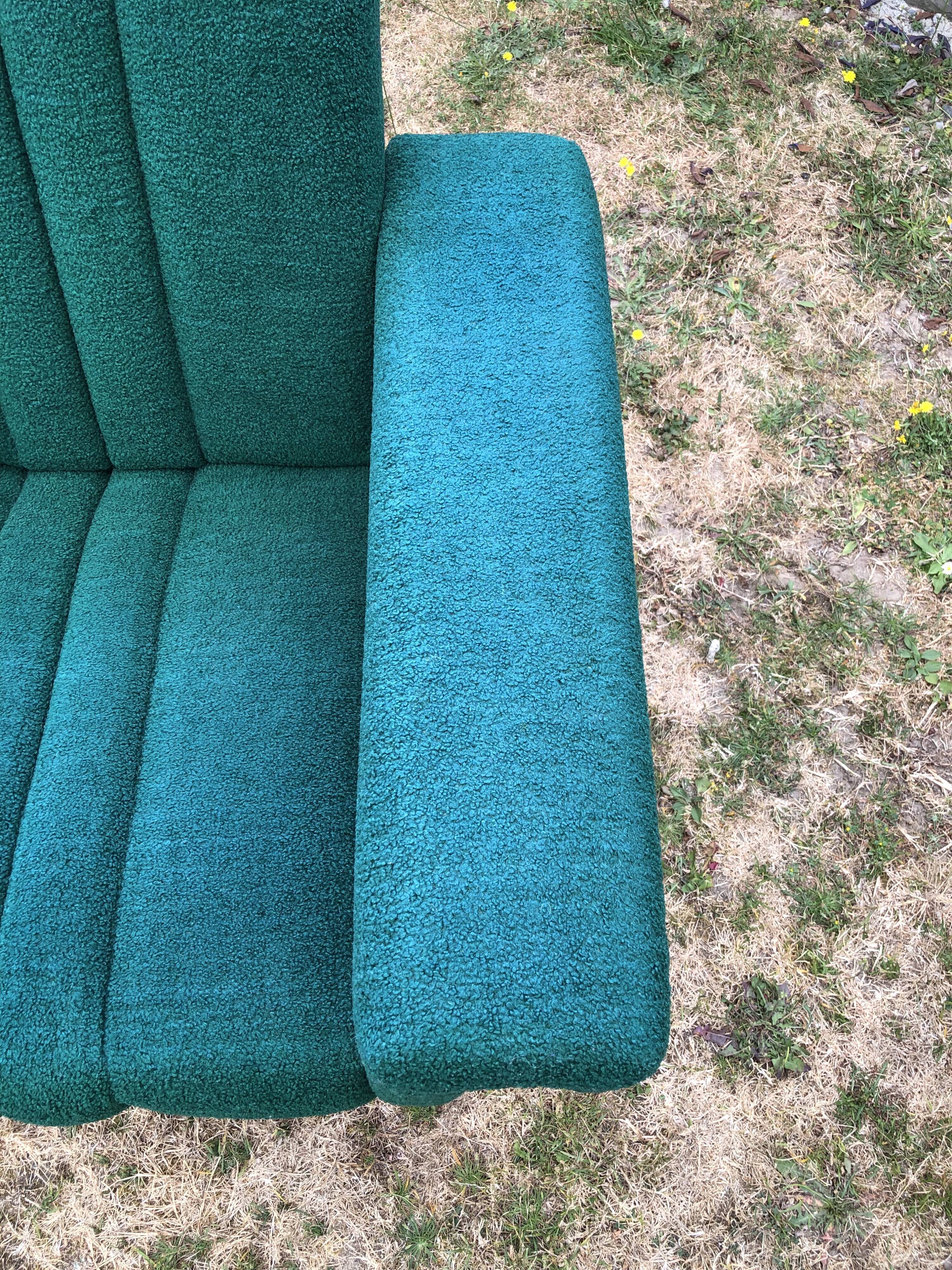 Duo of vintage armchairs with green fabrics.