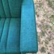 Duo de fauteuils vintage à tissus vert.