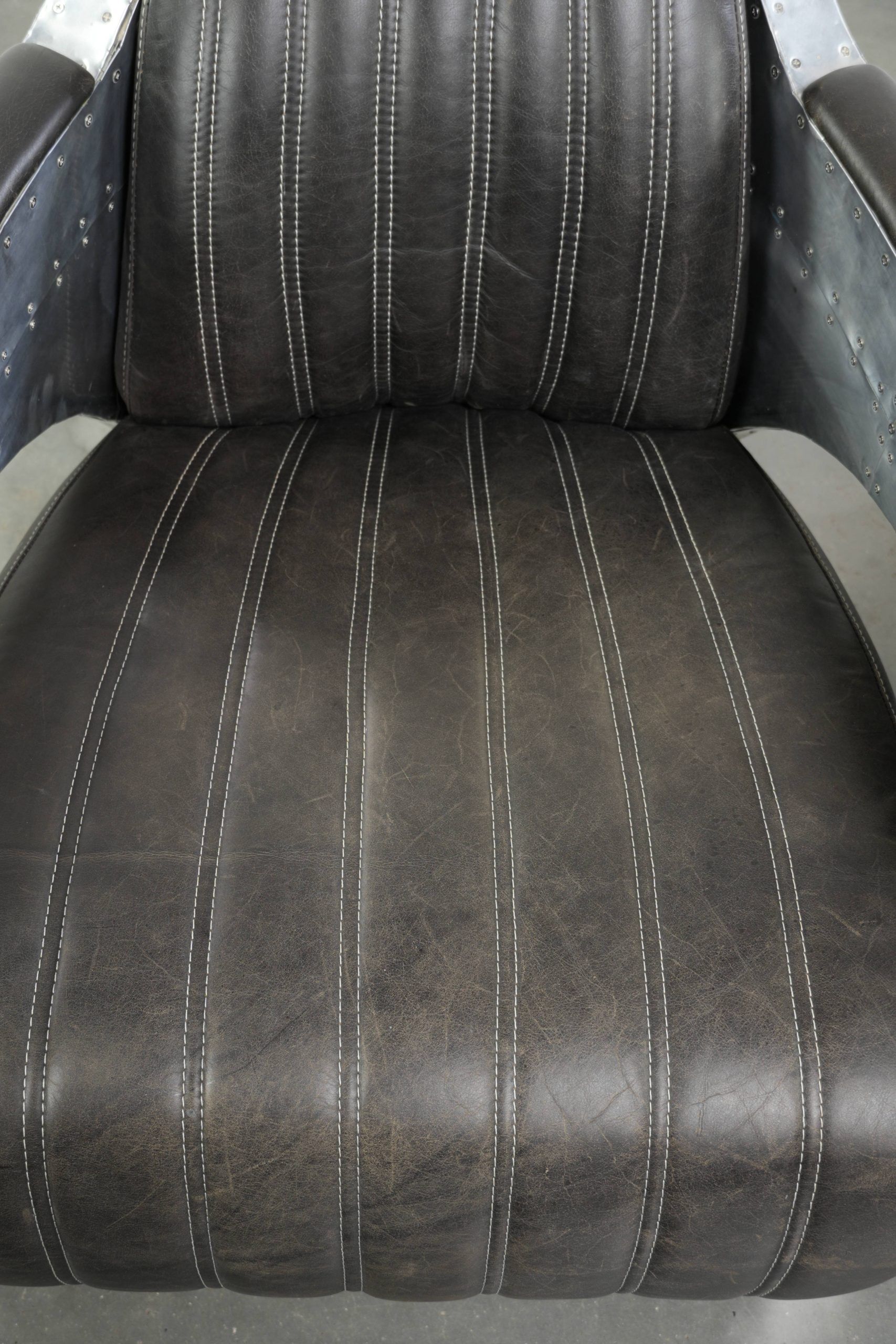 Set of 2 sturdy industrial black cowhide Aviator design armchairs with aluminium and rivets