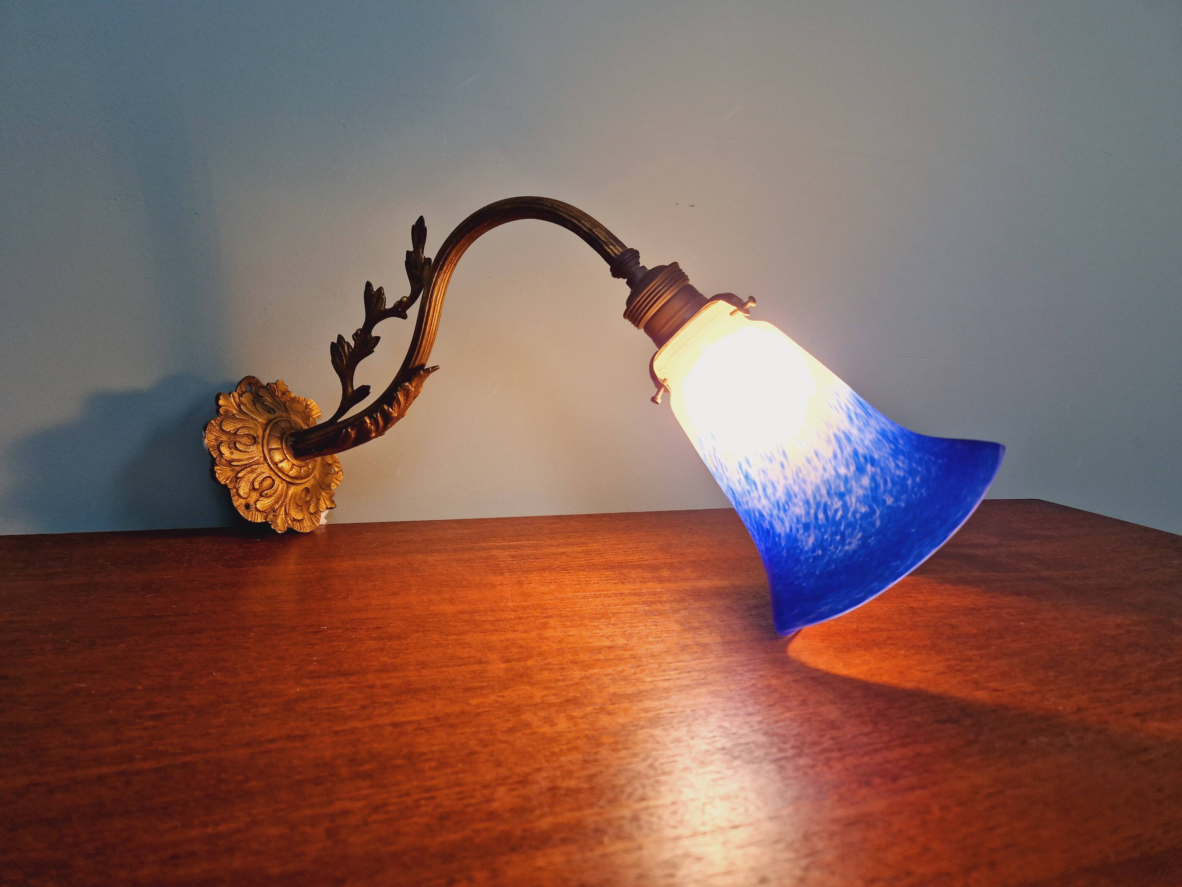 Wall light in gilded bronze and blue marmoreal glass, early 20th century