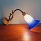 Wall light in gilded bronze and blue marmoreal glass, early 20th century