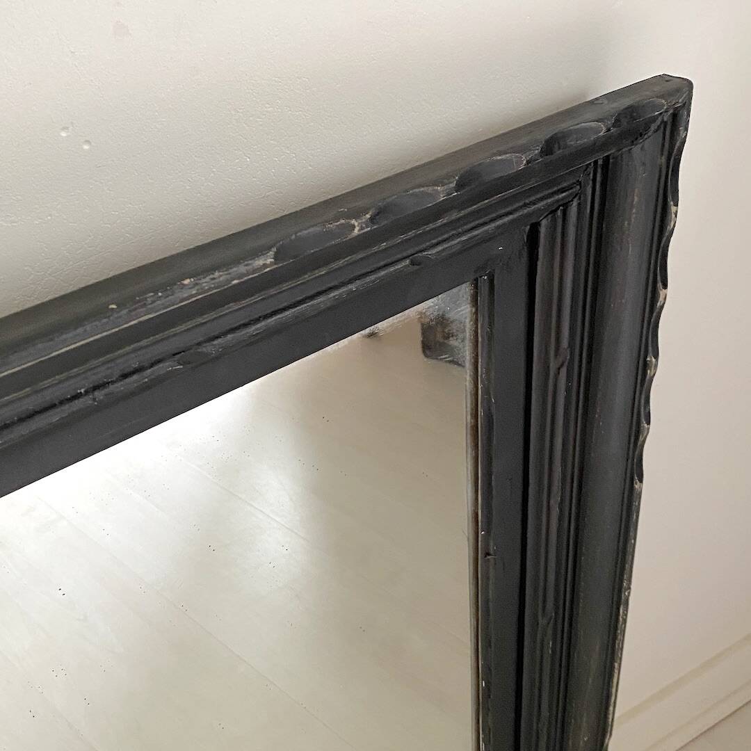 1950s mirror, matte black wood with a patina.