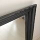 1950s mirror, matte black wood with a patina.
