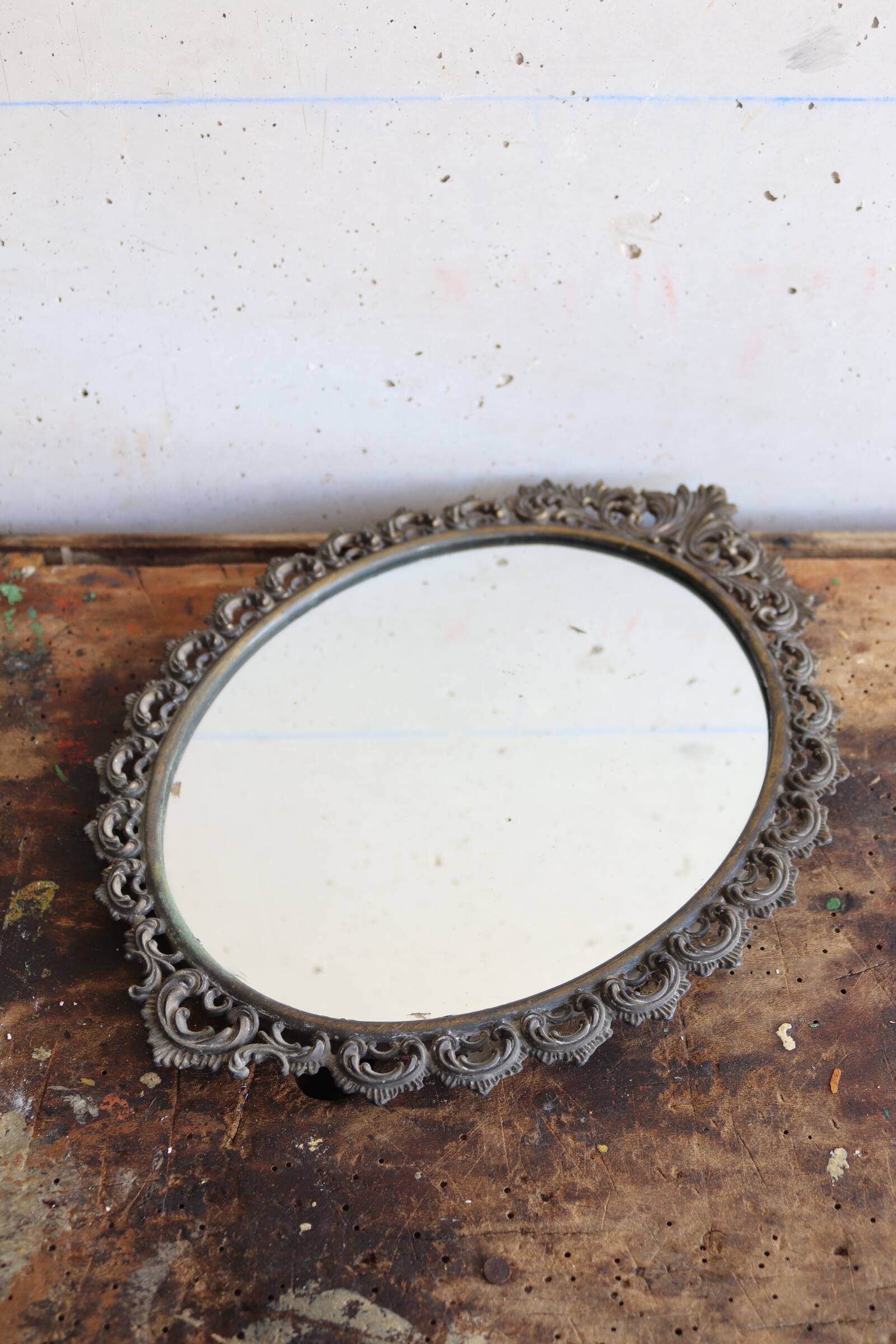 Baroque style oval metal mirror