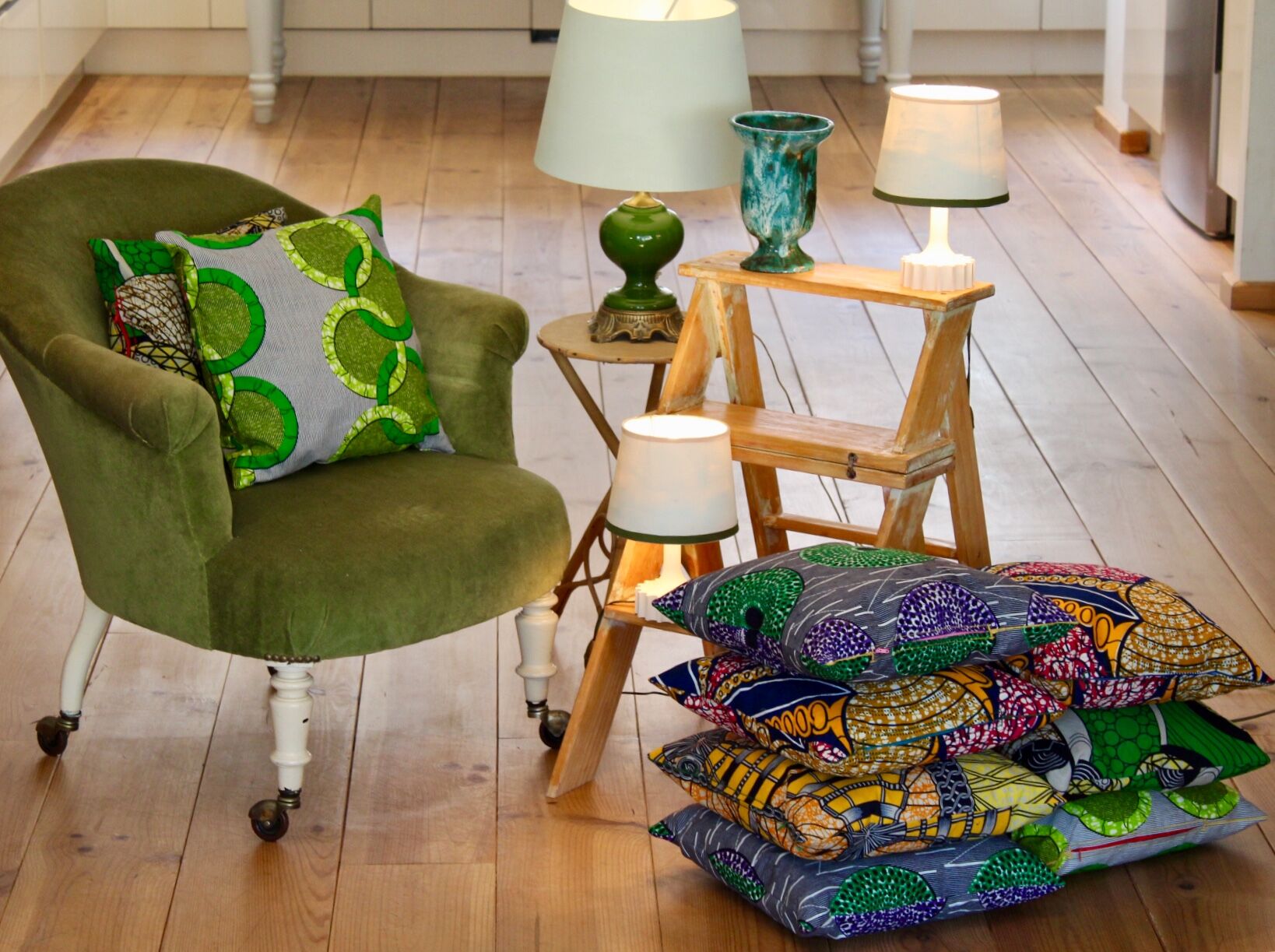 Toad in almond green velvet armchair on castors