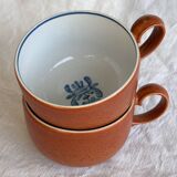 2 very and earthenware coffee cups
