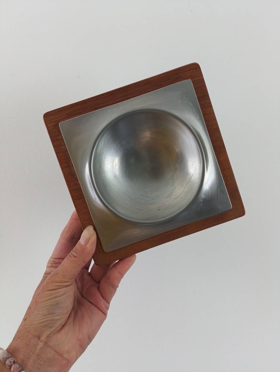 Stainless steel and wood pocket emptier