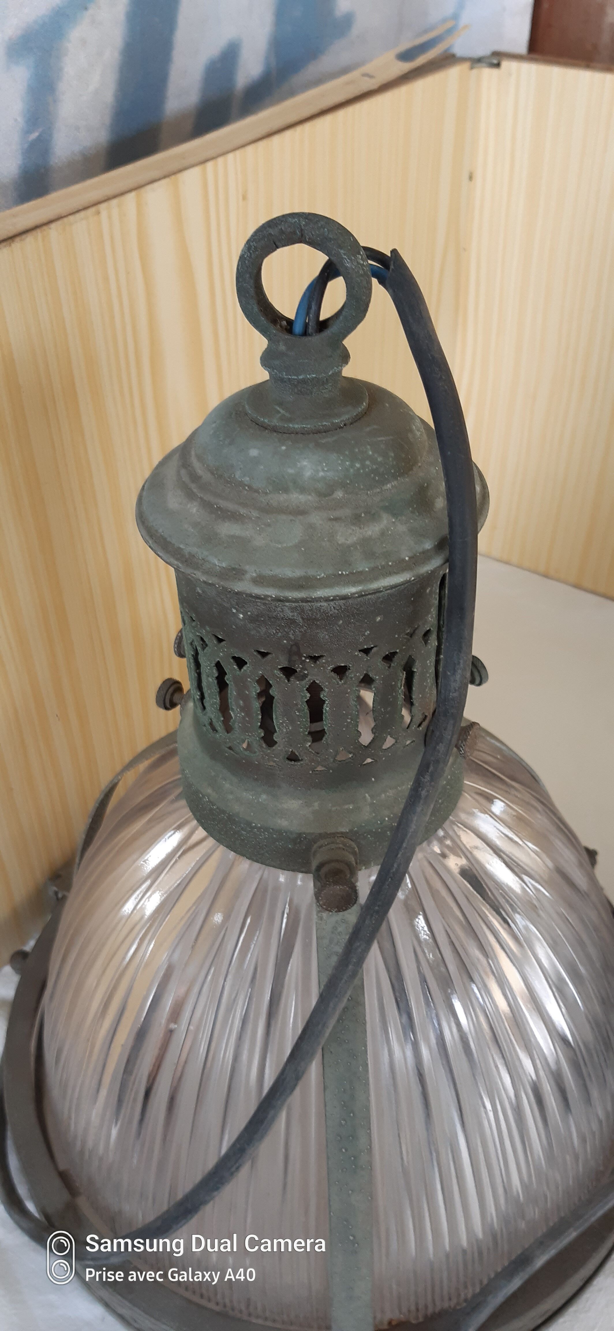 2 holophanous industrial lamps