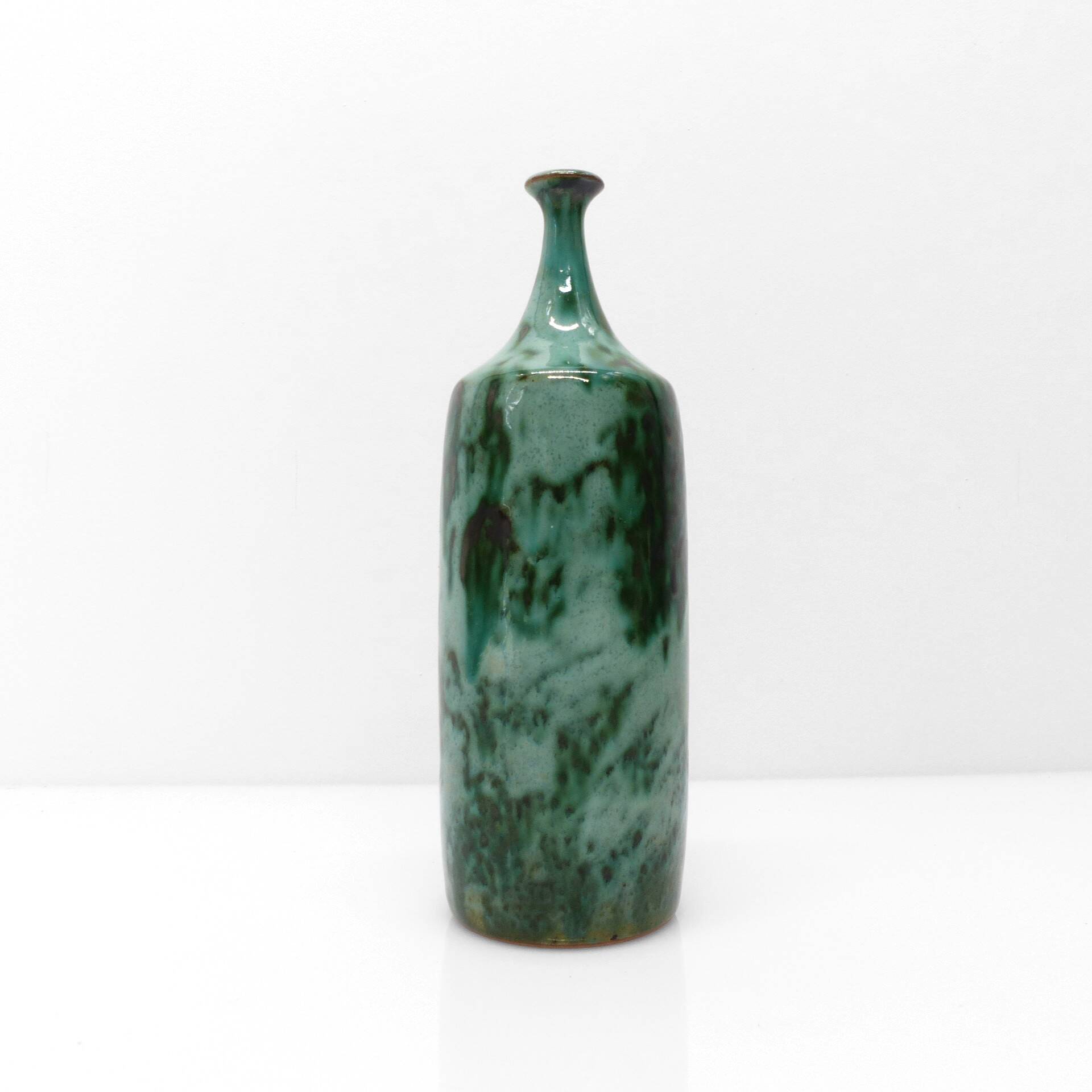 Green glazed stoneware bottle vase with copper highlights 1960-1970