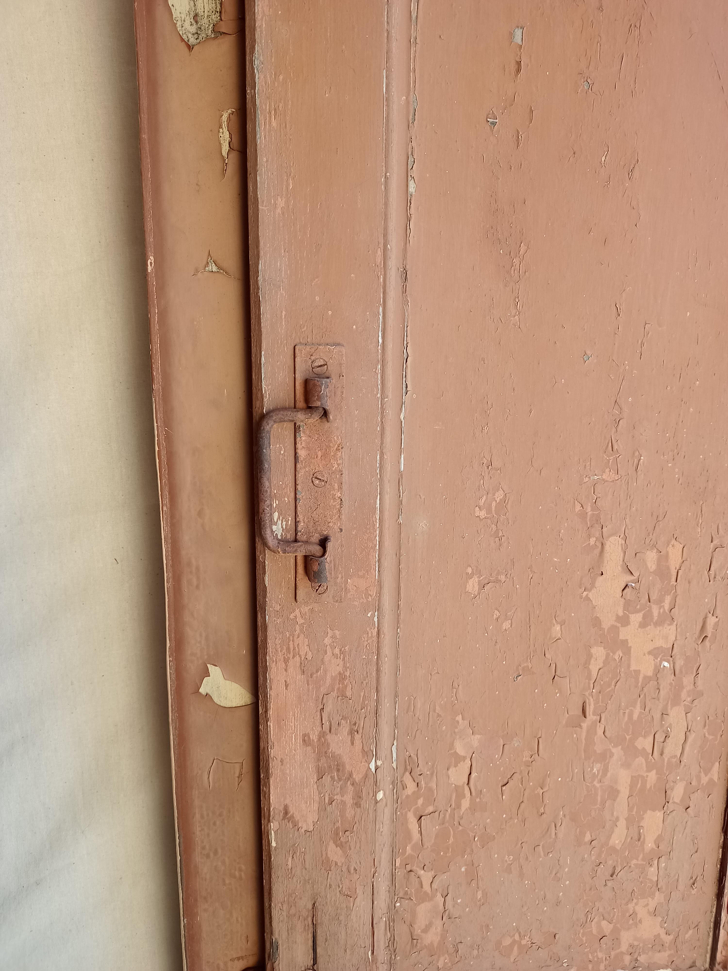 Old glazed door with its shutter