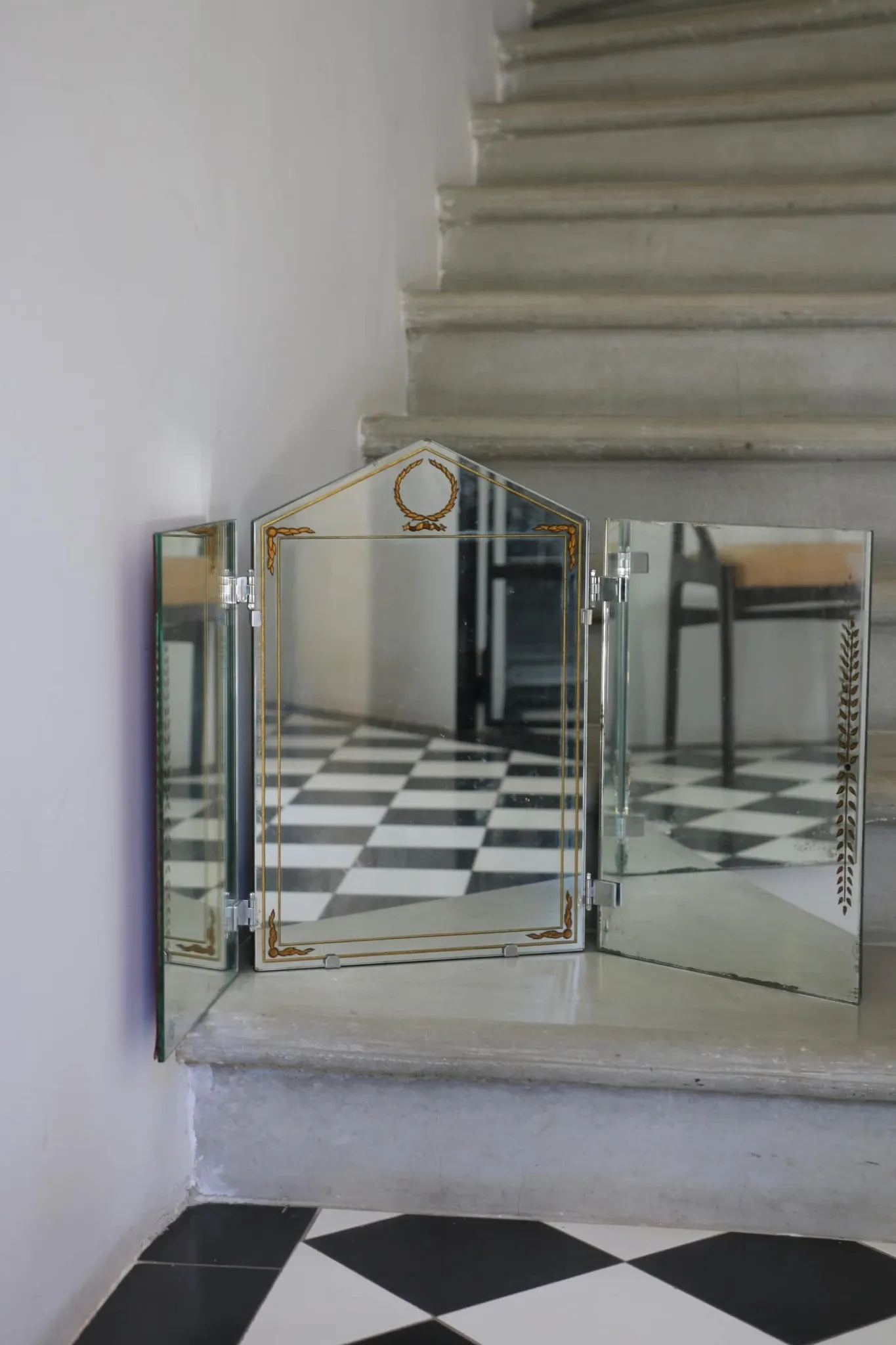 Triptych mirror with eglomisé and pediment, 1940s-50s