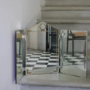 Triptych mirror with eglomisé and pediment, 1940s-50s