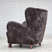 Années 1960, design danois, fauteuil rembourré, véritable peau de mouton.