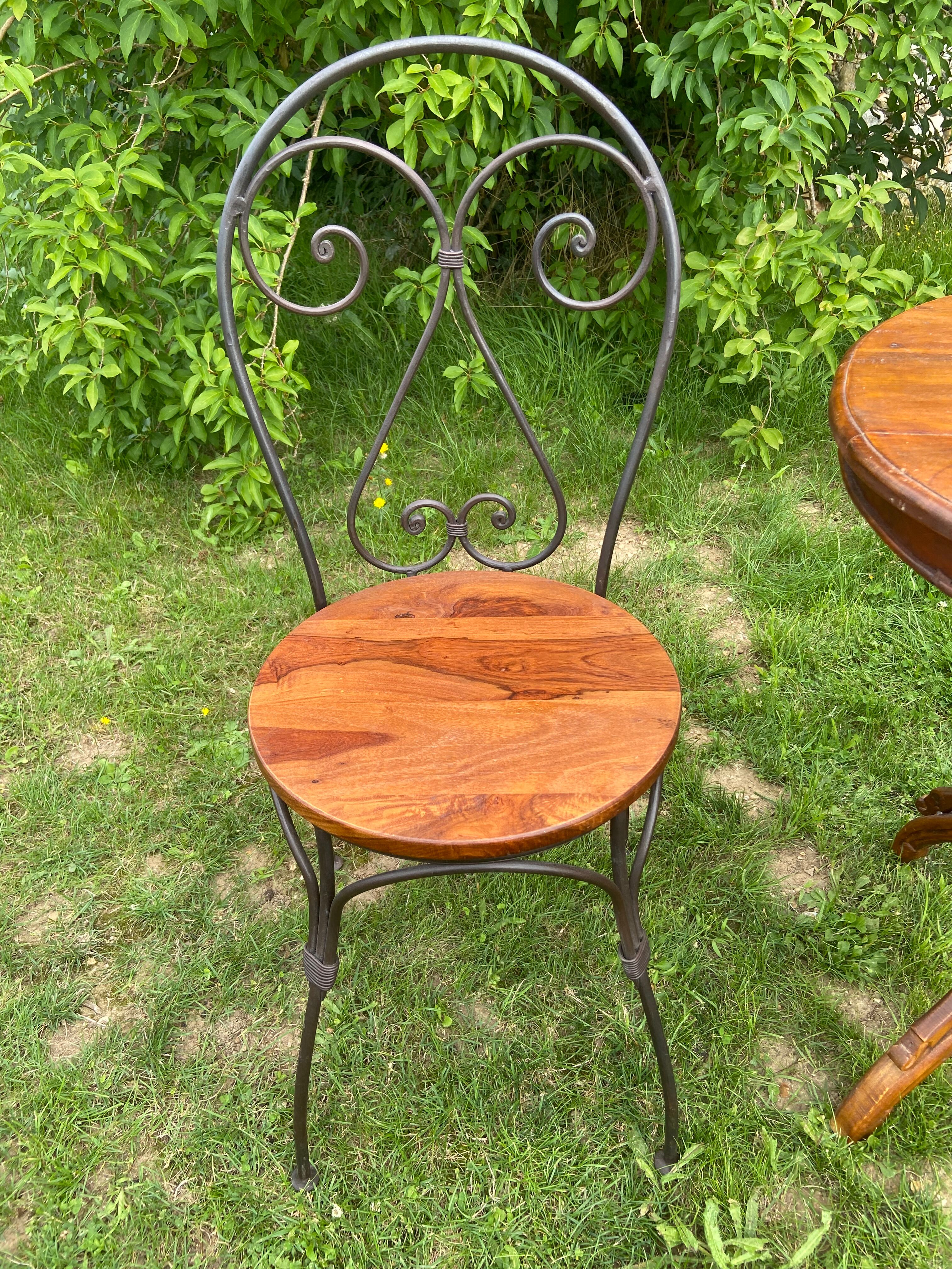 Round table and wrought iron chair