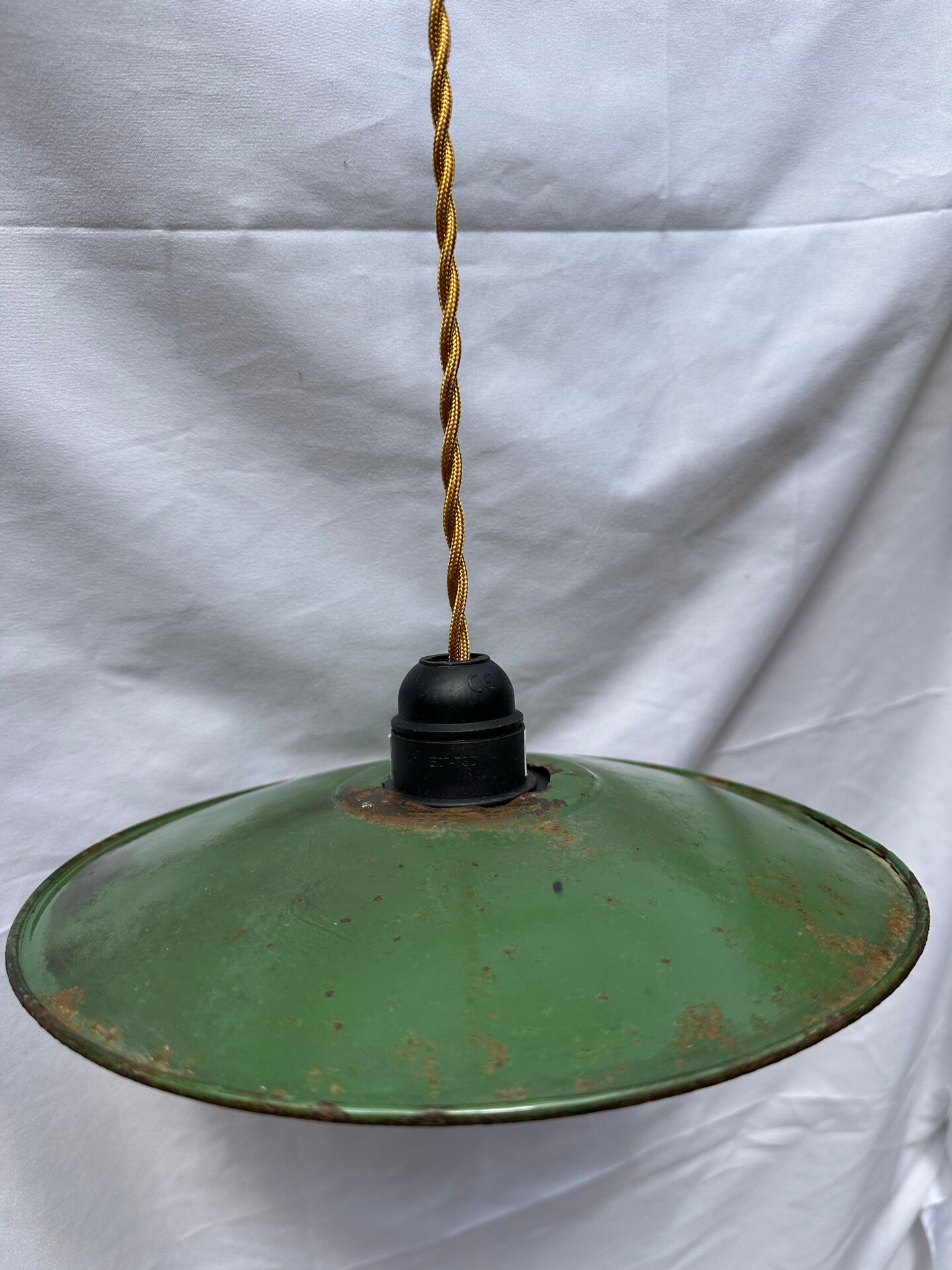 Old green and white enamelled sheet metal suspension