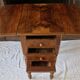 Nineteenth-century walnut work table with flaps, large storage + secret drawer.