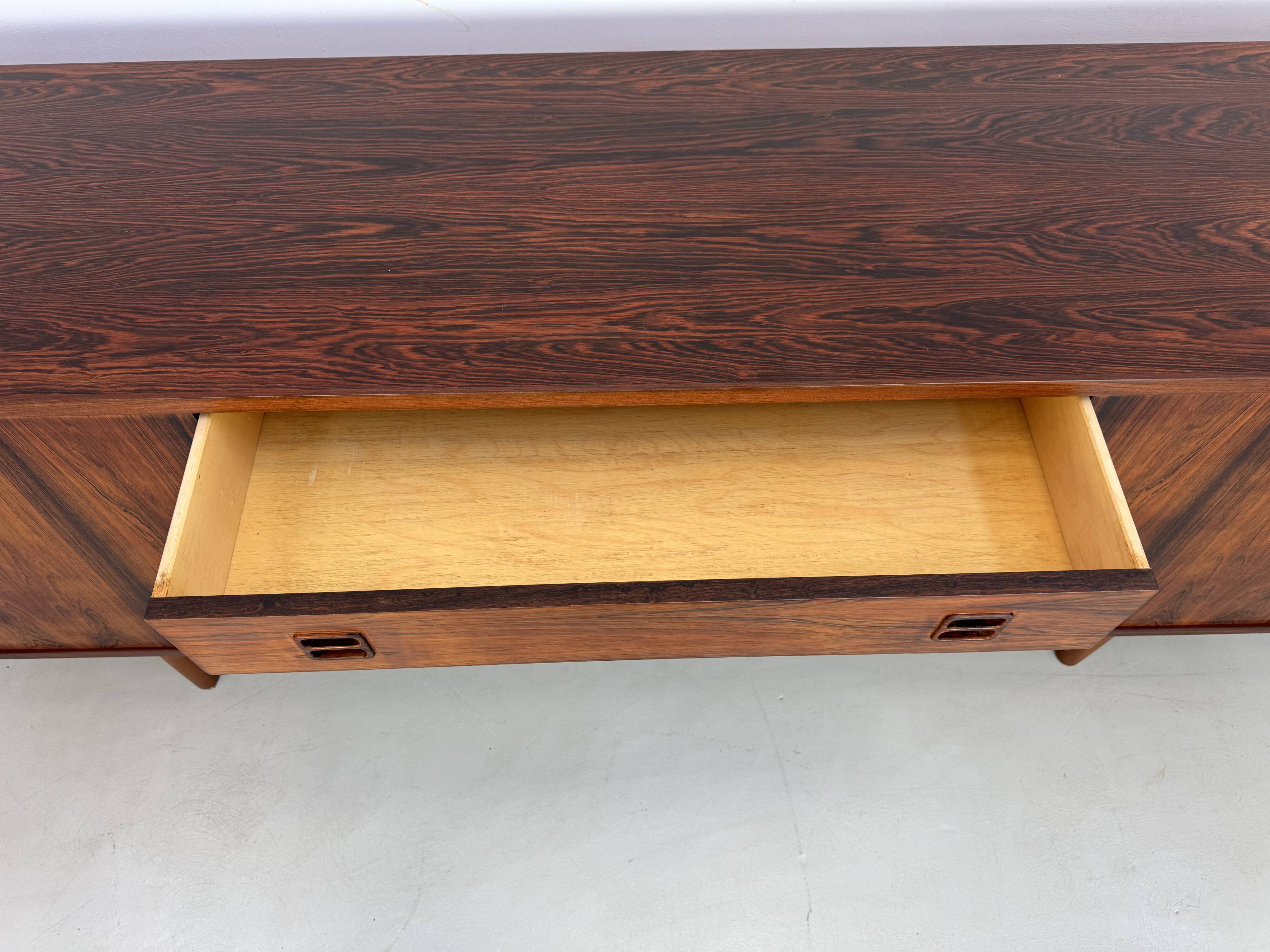 Danish rosewood vintage sideboard with sliding teak doors from the 1960s