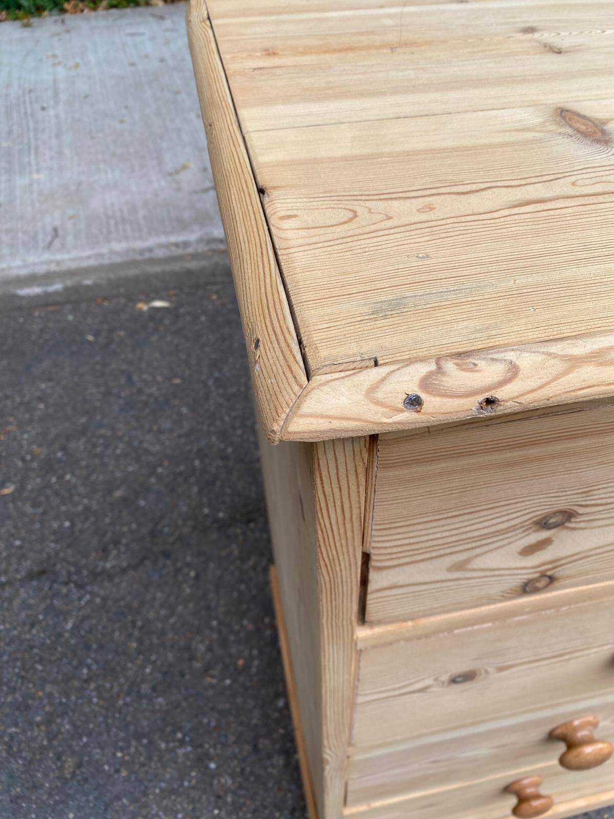 Victorian commode from the 19th century stripped to raw solid wood with ceramic knobs.