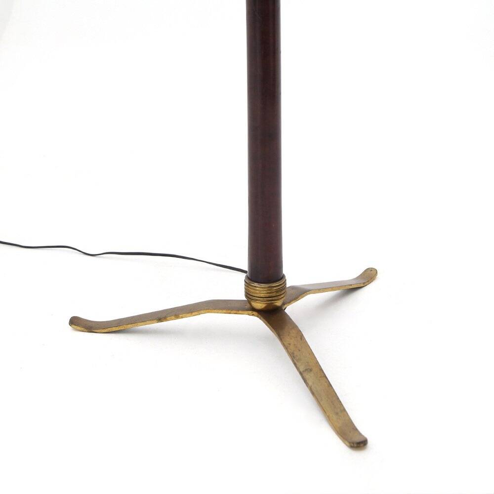 Floor lamp with a brass base and parchment shade, 1940s.