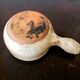 Beige glazed terracotta caquelon