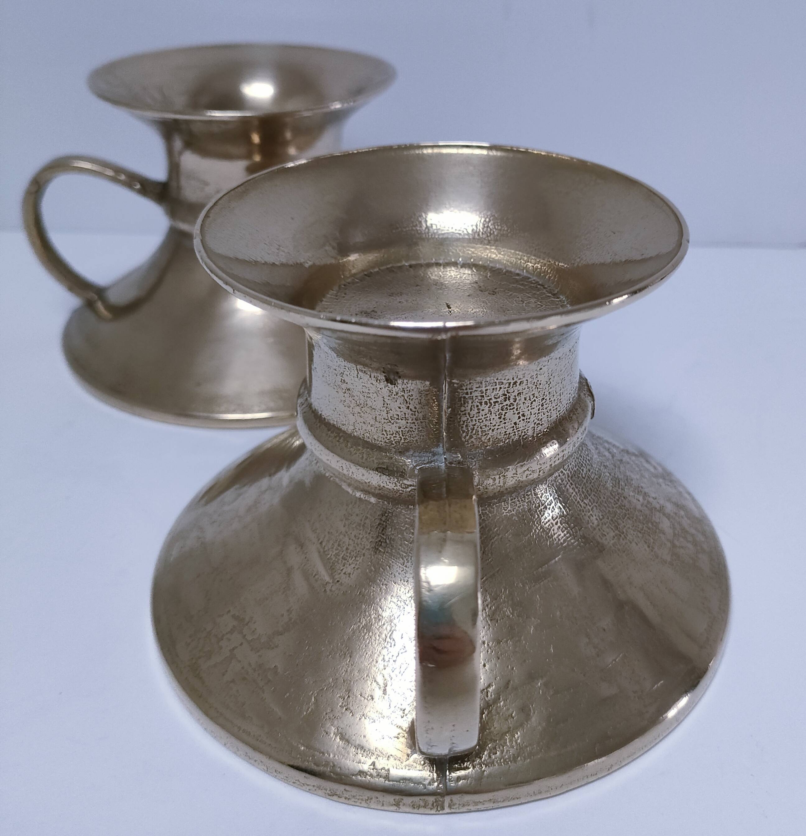 Pair of vintage solid brass hand candlesticks