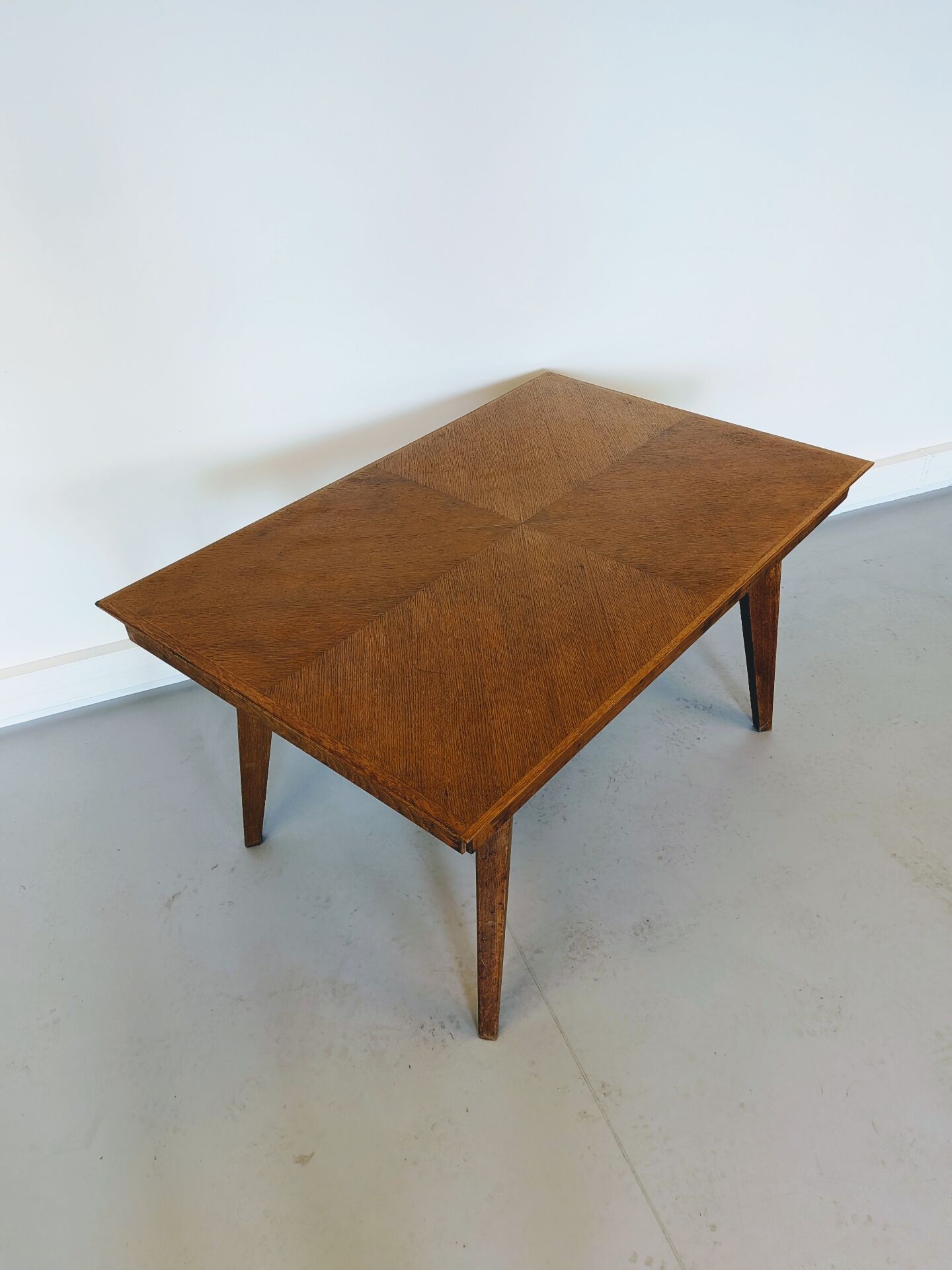 Vintage Scandinavian wooden dining table with tapered legs.